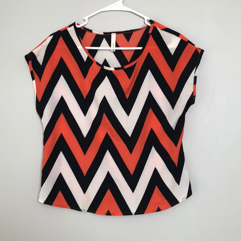 Orange, black, and white top!